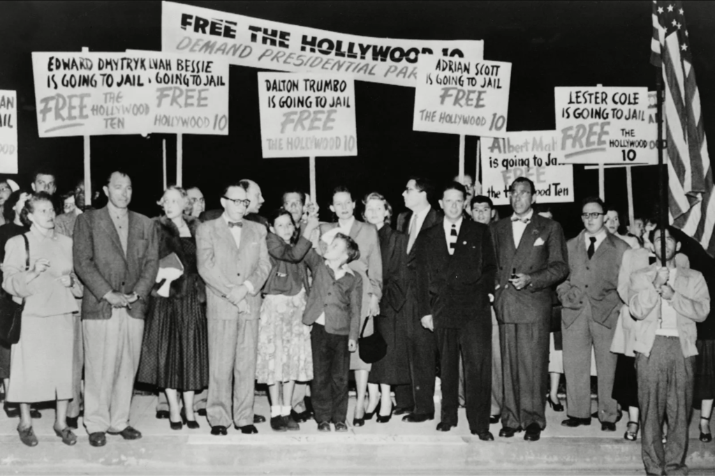 A black and white photo of people protesting in favour of the Hollywood Ten.