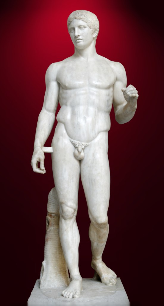 Doryphoros from Pompeii. A Roman marble sculpture of a man standing contraposto with his left arm raised slightly.