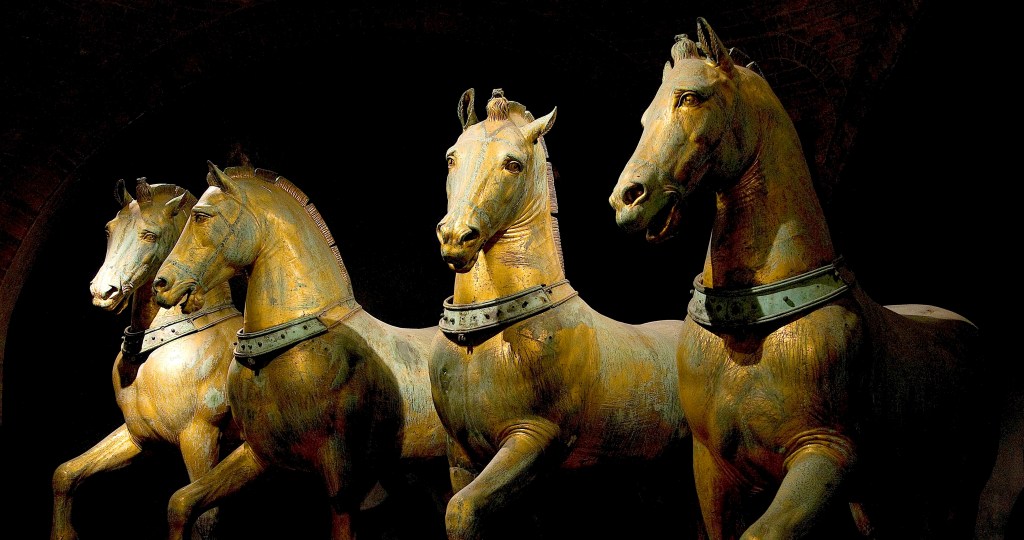 Four bronze horses known as the "Triumphal Quadriga". Thought to be created in the first or second century CE but modelled on classical Greek sculptures.